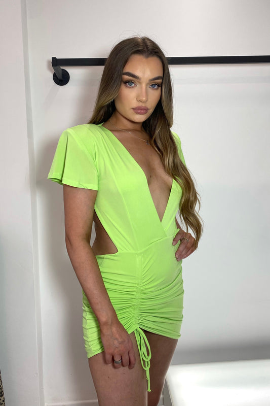 RIO BACKLESS PLUNGE DRESS FEATURING PADDED SHOULDER AND SHORT FLARED SLEEVE